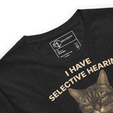 Unisex t-shirt featuring a moody tabby cat with glasses and the quote 'I Have Selective Hearing.' Perfect for sarcasm lovers.