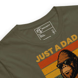 Bigfoot-themed dad T-shirt featuring Sasquatch in sunglasses and the text 'Just a Dad Who Always Came Back with the Milk'.