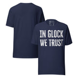 In Glock We Trust Retro Unisex T-Shirt featuring distressed text design on navy fabric.