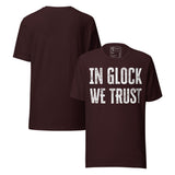 In Glock We Trust Retro Unisex T-Shirt in maroon color featuring distressed block text design on a t-shirt.
