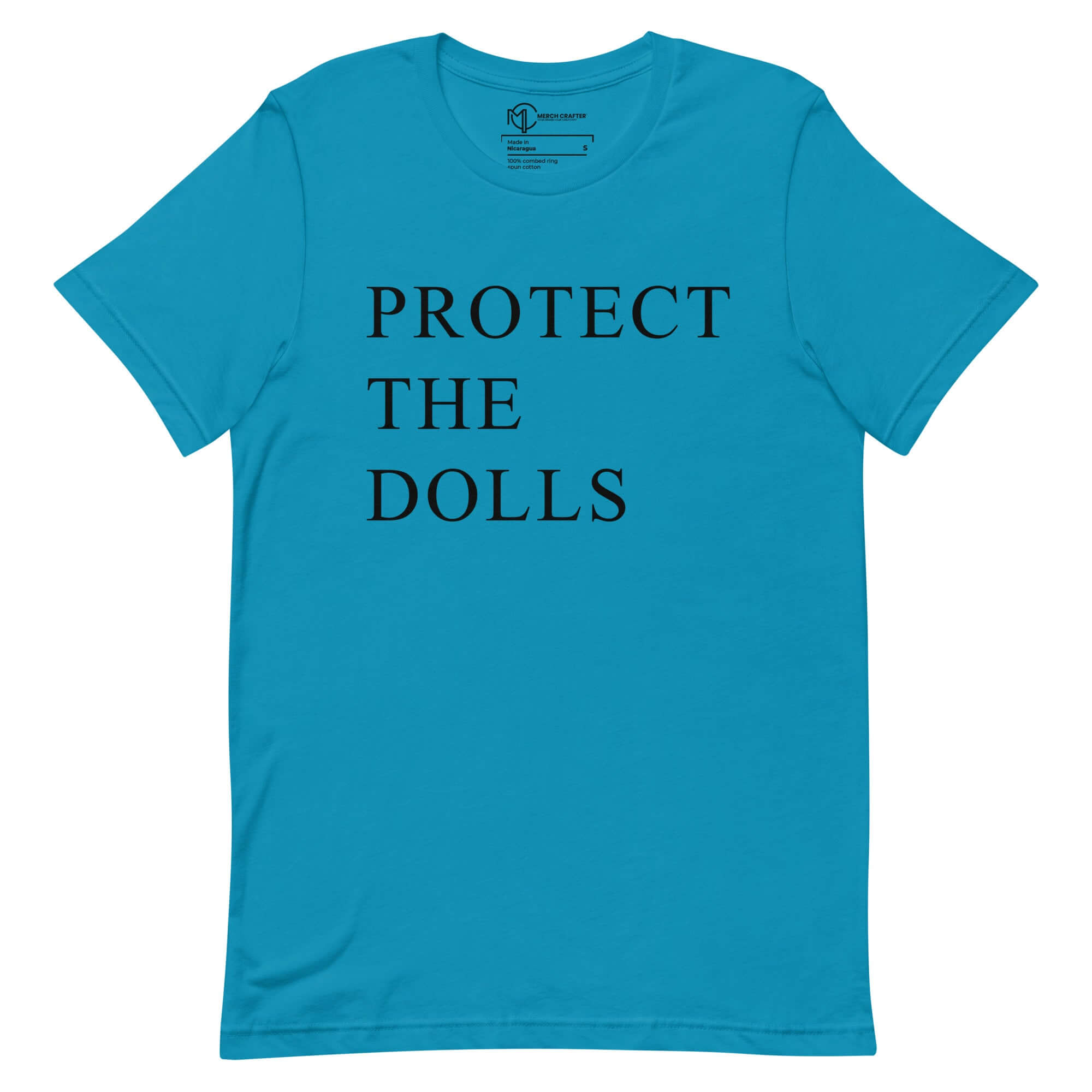 Protect the Dolls unisex t-shirt in blue with bold black text promoting femininity and strength.