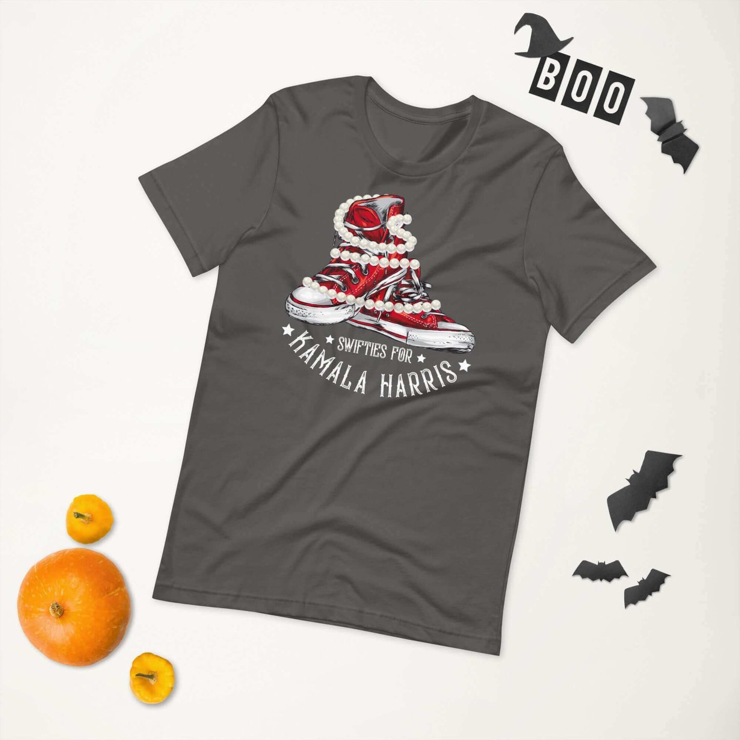 Swifties for Kamala Chucks and Pearls Harris VOTE unisex t-shirt with sneakers and pearls graphic, Halloween decor in the background