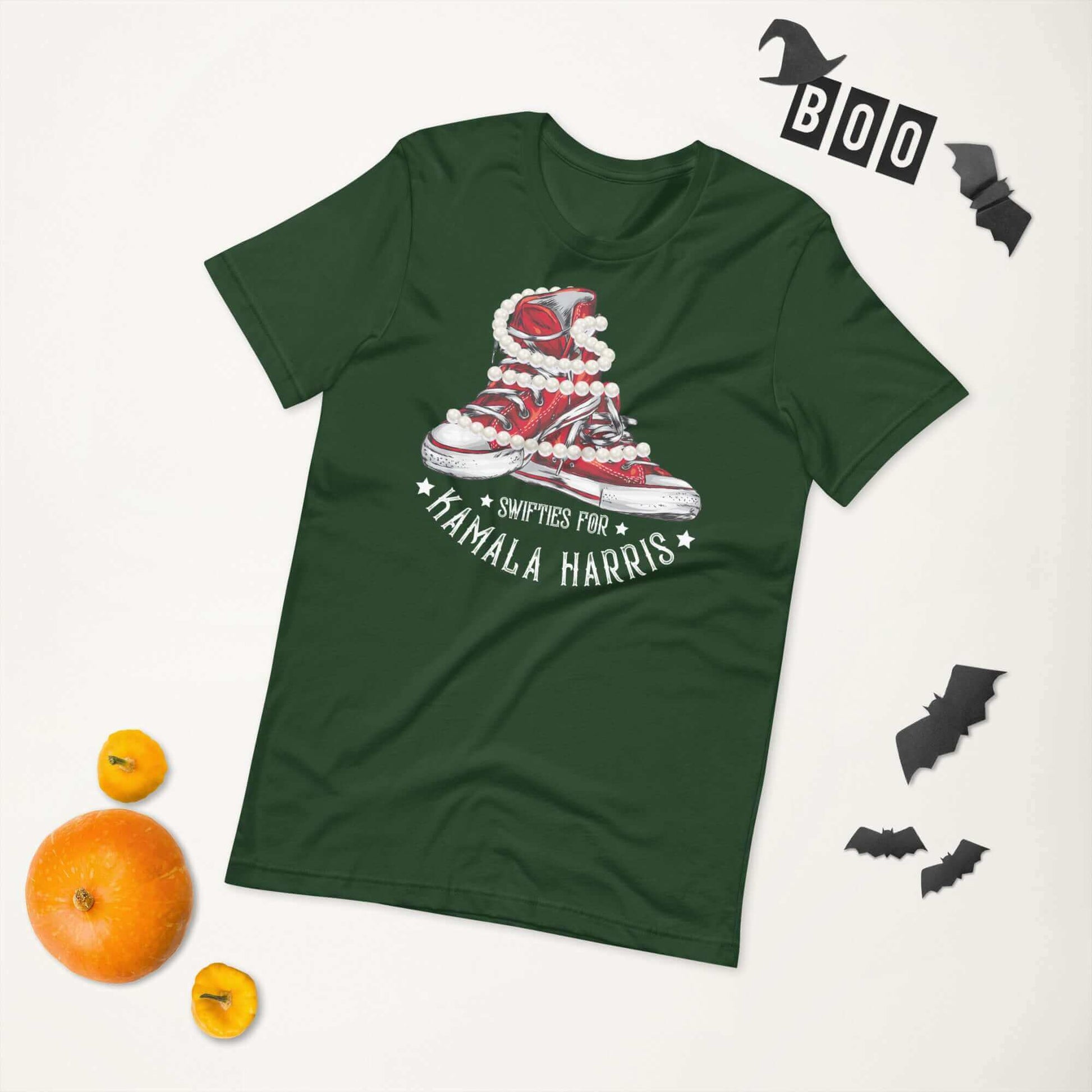 Green unisex t-shirt with Swifties for Kamala Harris design, featuring chucks and pearls graphic.