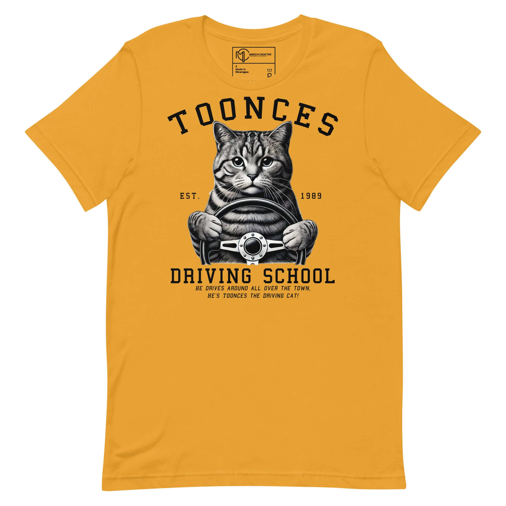 Toonces Driving School Est. 1989 t-shirt featuring a serious cat gripping a steering wheel in a fun illustration.