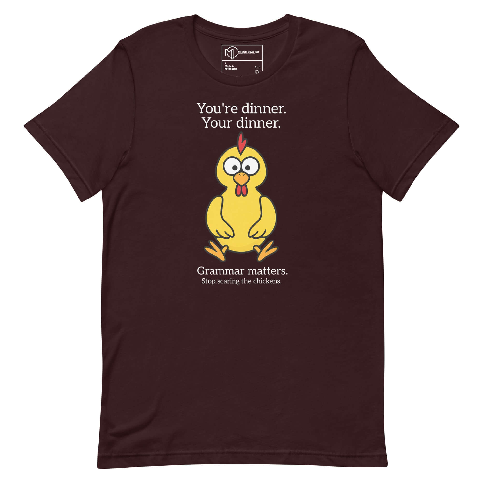 Funny unisex t-shirt featuring a cartoon chicken with grammar quote: "You're dinner. Your dinner. Grammar matters."