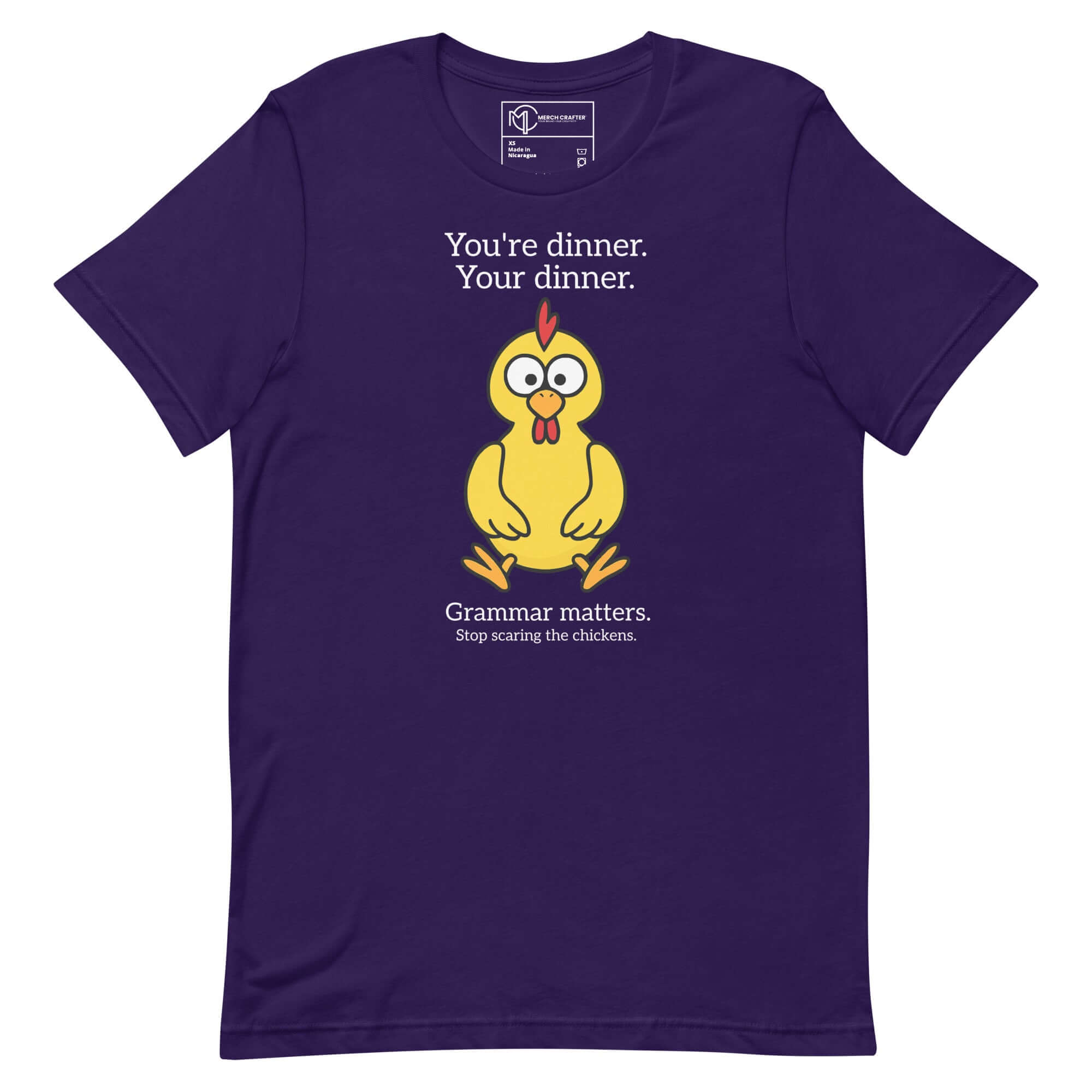 Funny purple t-shirt featuring a cartoon chicken with the quote about grammar: "You're dinner. Your dinner. Grammar matters."