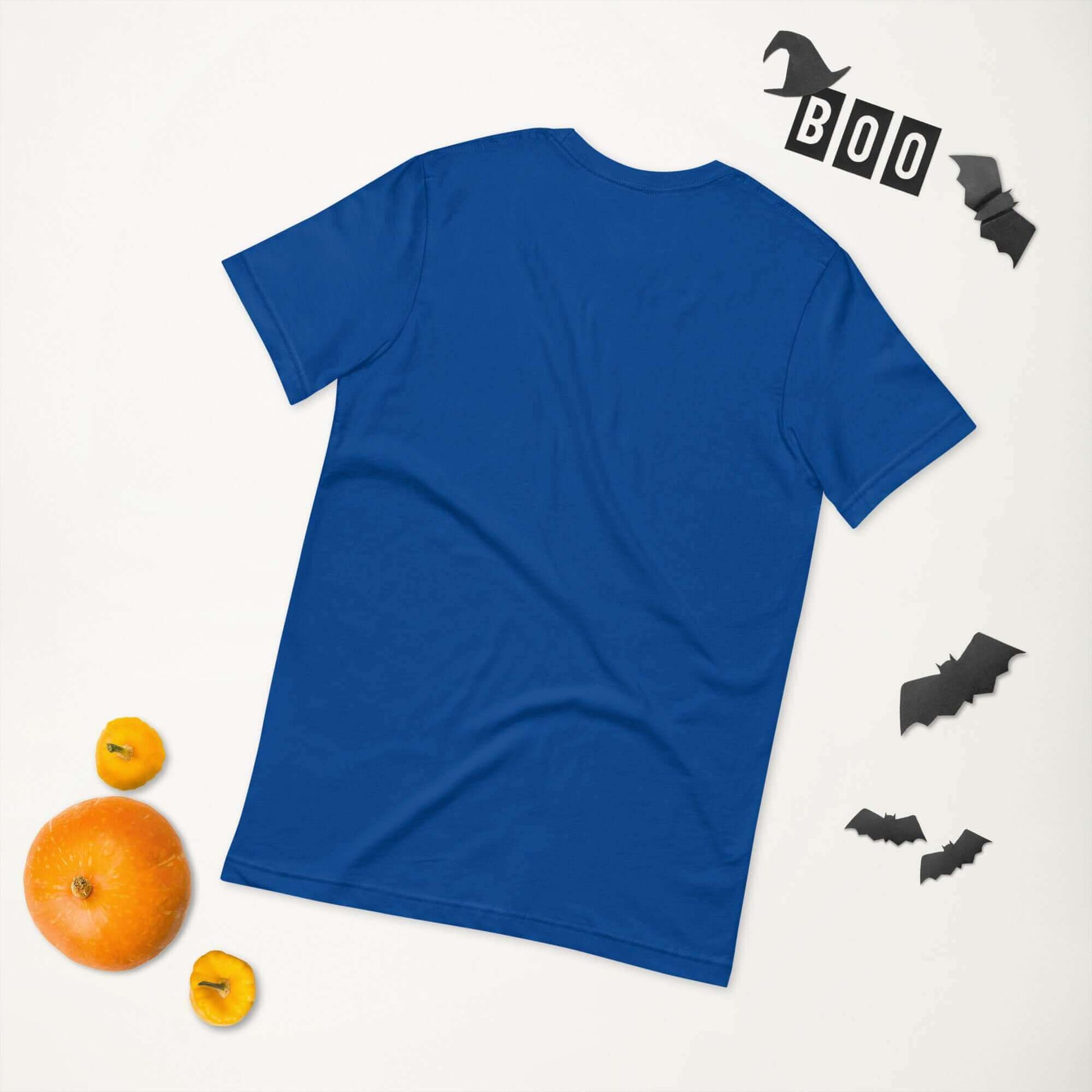 Blue unisex t-shirt with Halloween decorations, including pumpkins and bat cutouts.