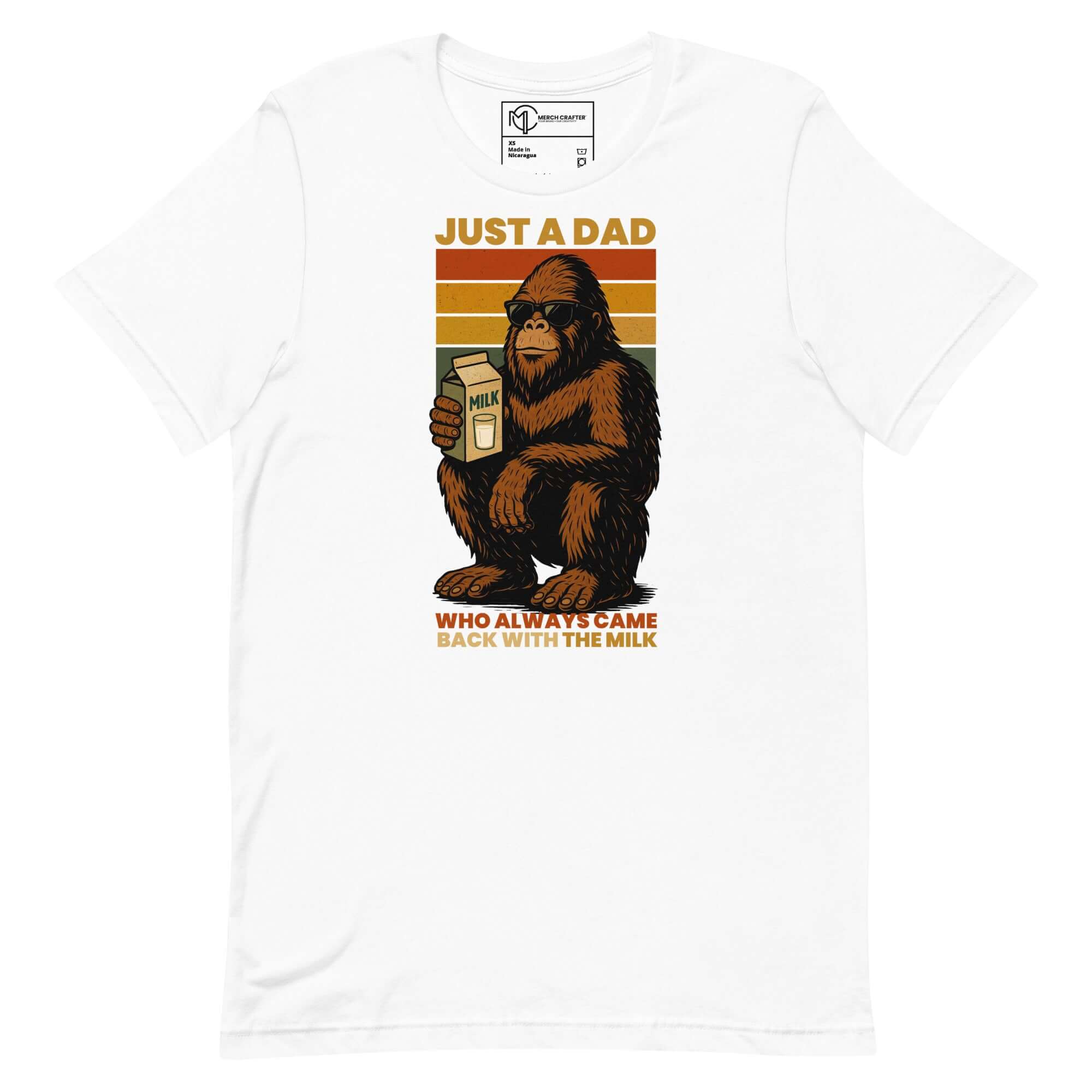 Just a dad Bigfoot T-shirt with a Sasquatch holding milk, vintage rainbow stripes background.